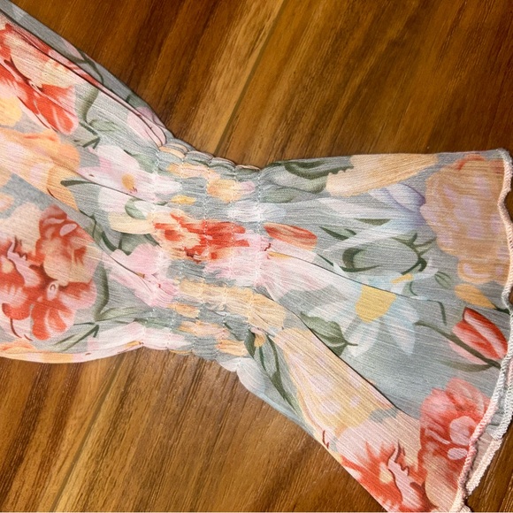 NWOT Floral Long Sleeve Romper with tie in the back and smocked sleeves - Picture 5 of 8